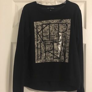 Long sleeve black and gold shirt.